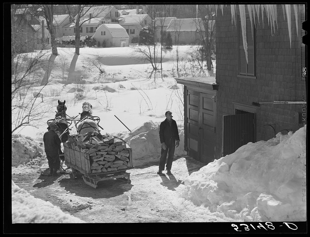 [Untitled photo, possibly related to: Unloading stove wood from sled woodshed. Woodstock, Vermont]. Sourced from the Library…