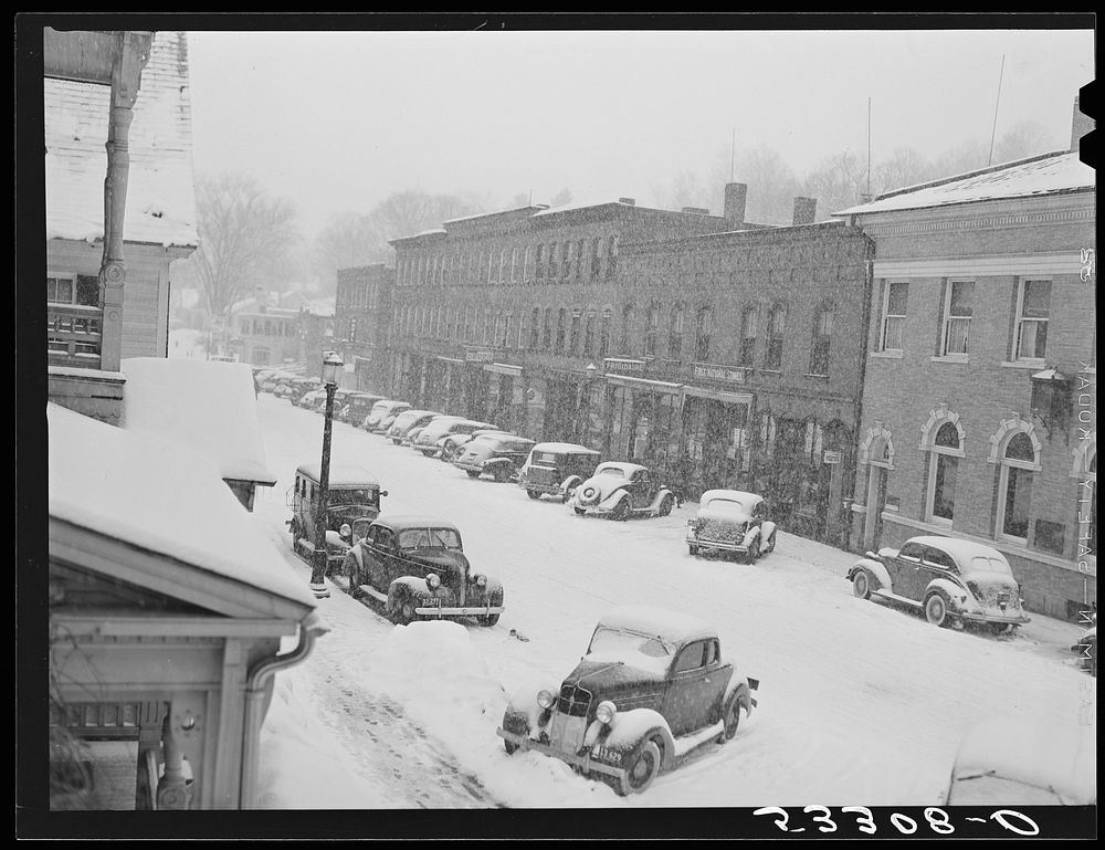 Center of town during snowstorm. Woodstock, Vermont. Sourced from the Library of Congress.