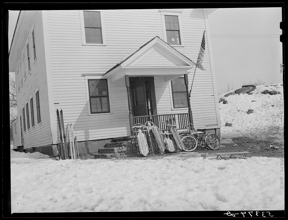 School, with children's sled and skis parked outside. Center Sandwich, New Hampshire. Sourced from the Library of Congress.