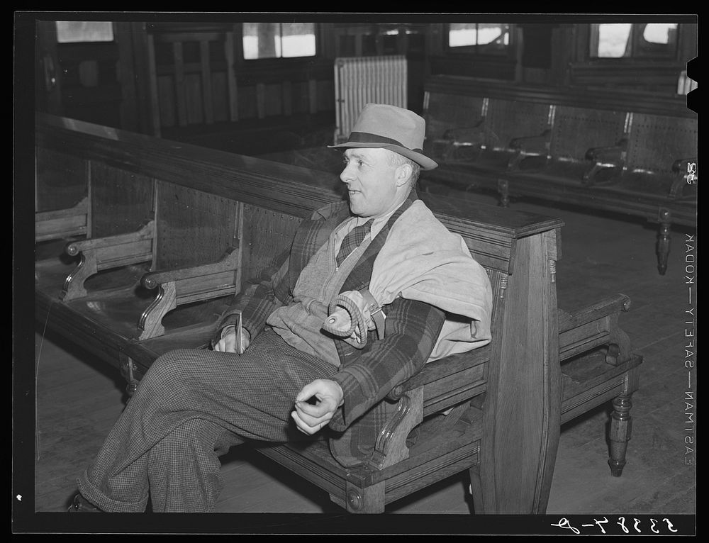 Postmaster waiting for train to arrive. Railway station, Mount Whittier, New Hampshire. Sourced from the Library of Congress.