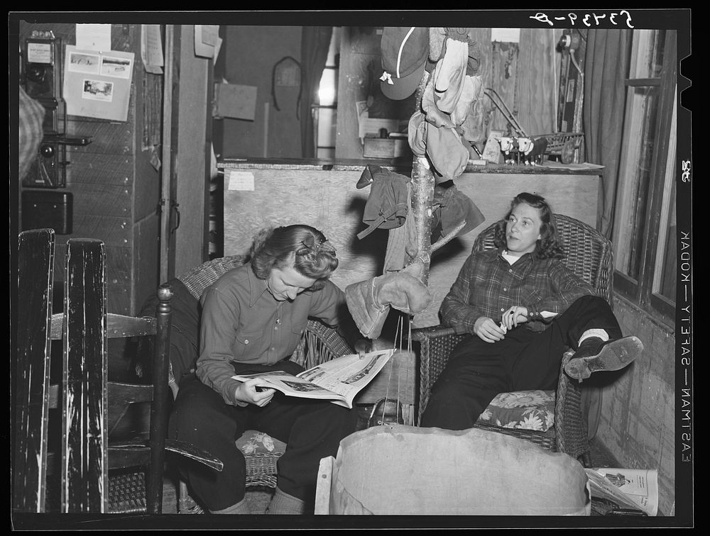 [Untitled photo, possibly related to: Skiers relaxing in lodge living room at North Conway, New Hampshire]. Sourced from the…
