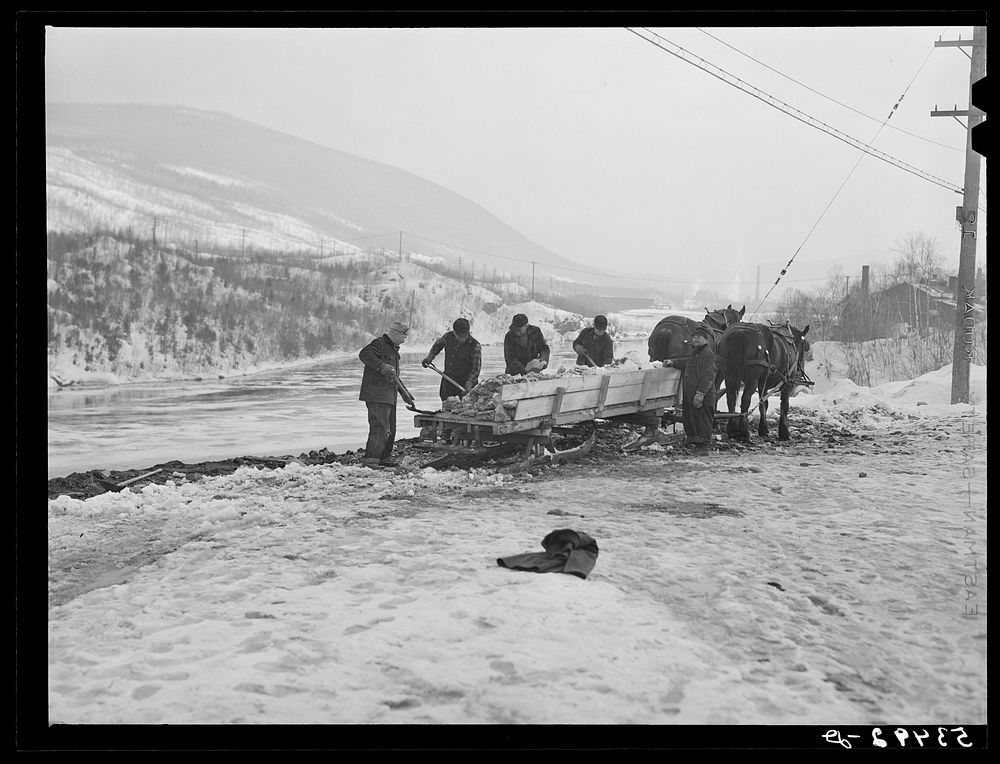 Dumping ice and snow from the streets of Berlin, New Hampshire into the river. Sourced from the Library of Congress.