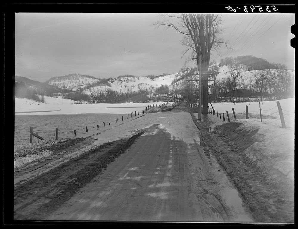 Spring thaw flooding field and road near Woodstock, Vermont. Sourced from the Library of Congress.