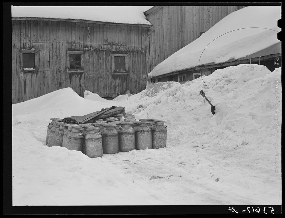 [Untitled photo, possibly related to: Farmhouse and milk cans near Saint Johnsbury, Vermont]. Sourced from the Library of…