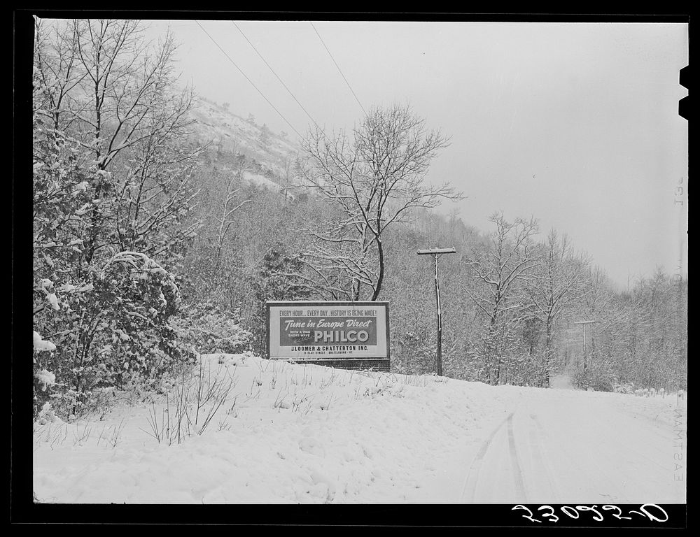 Highway during blizzard near Brattleboro, Vermont. Signboard on highway. Sourced from the Library of Congress.