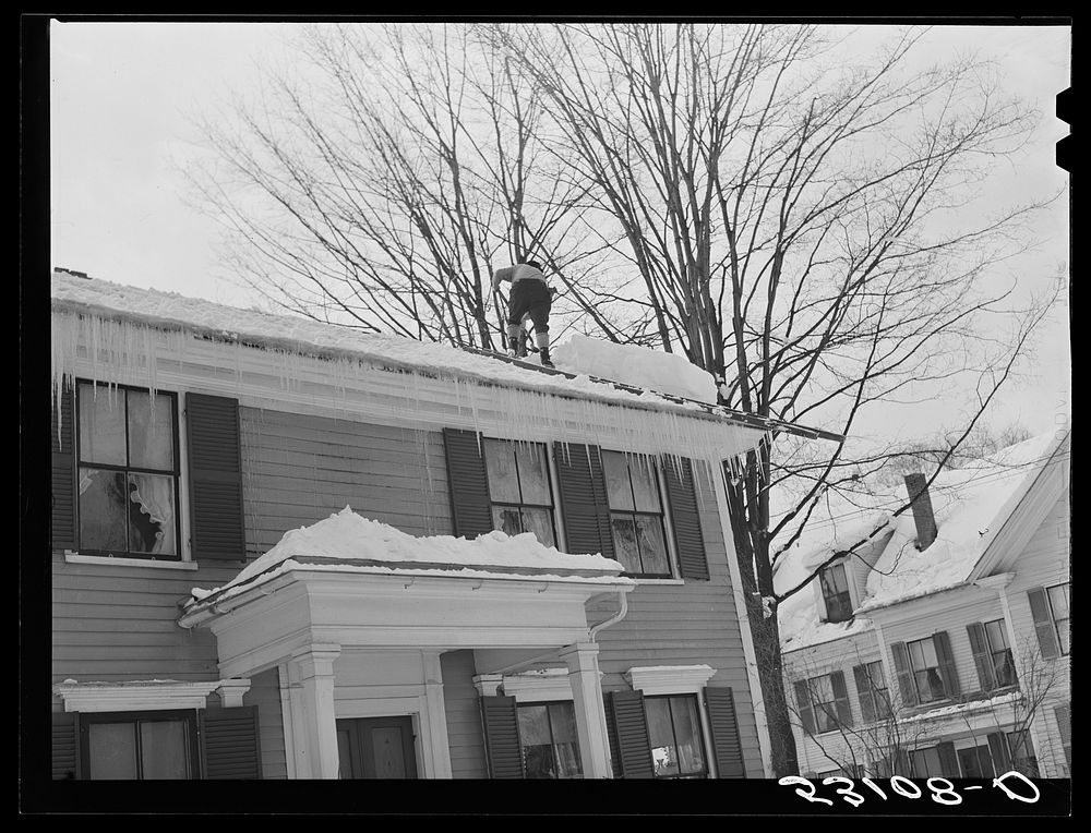 [Untitled photo, possibly related to: Shoveling heavy snow off roof of house in Woodstock, Vermont]. Sourced from the…