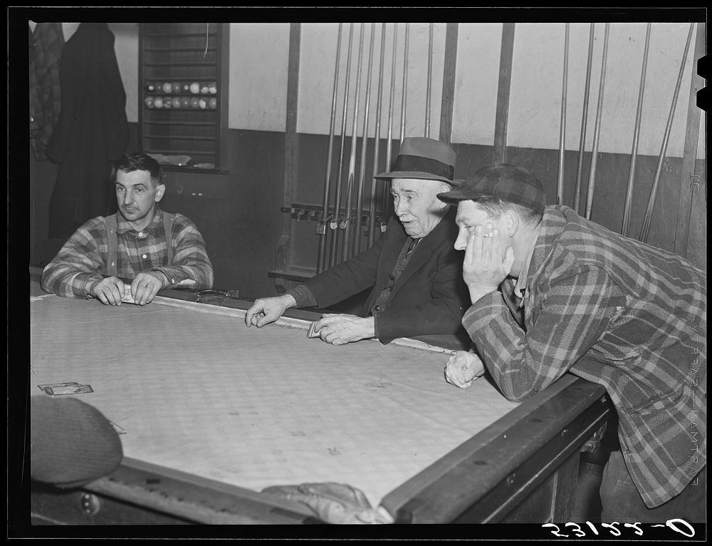 Farmers playing cards in pool room in town on a winter morning. Woodstock, Vermont. Sourced from the Library of Congress.