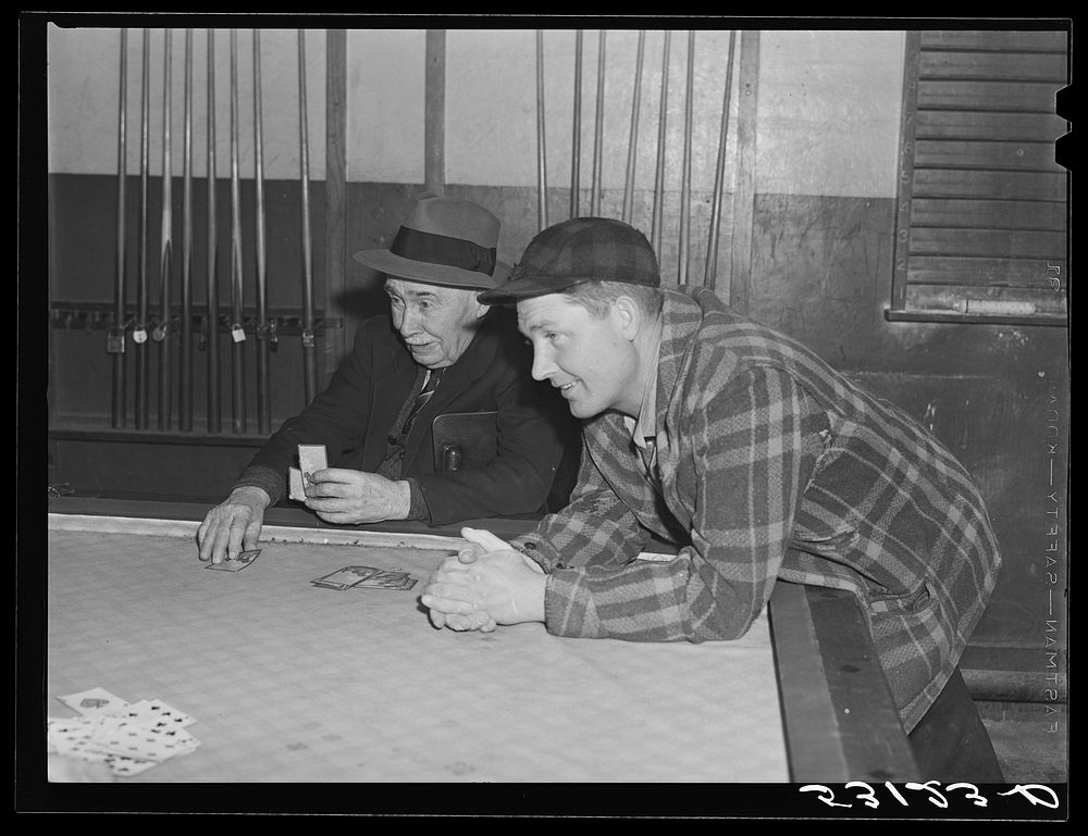 Farmers playing cards in pool room in town on a winter morning in Woodstock, Vermont. Sourced from the Library of Congress.