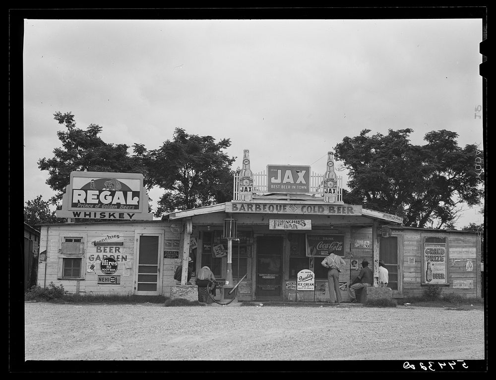 [Untitled photo, possibly related to: Melrose, Natchitoches Parish. Louisiana crossroads store, bar "jook joint," and gas…