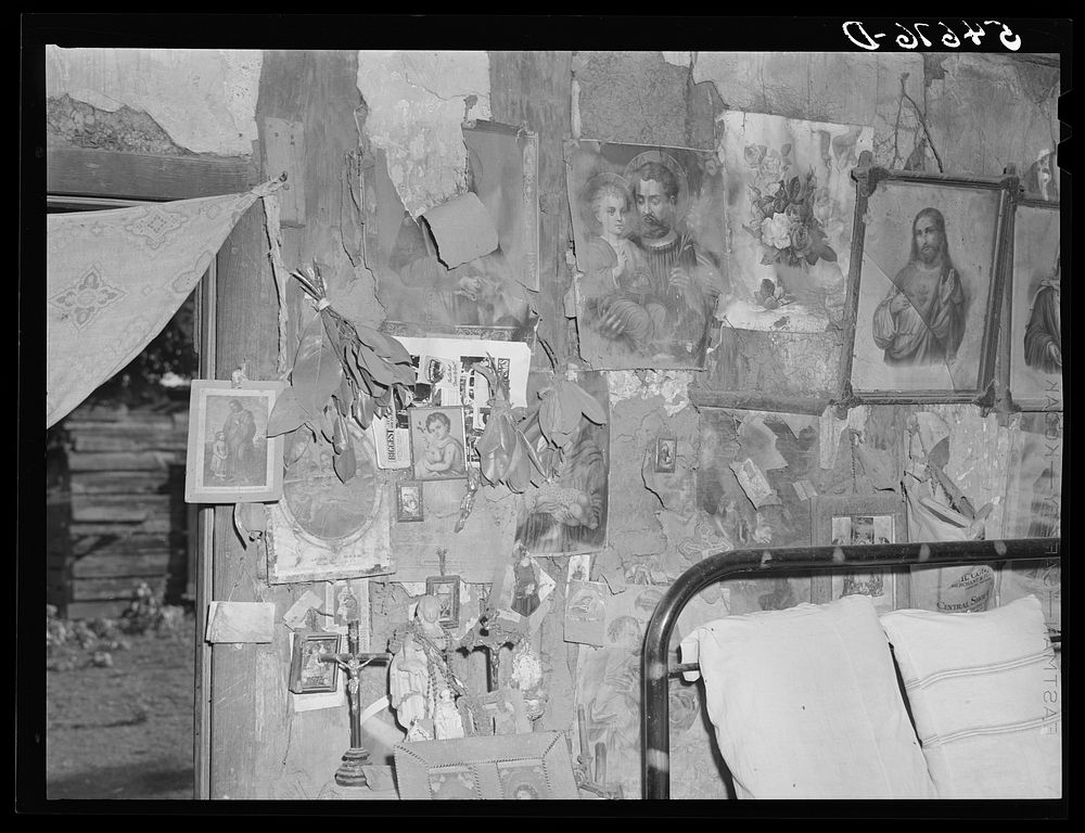 Melrose, Natchitoches Parish, Louisiana. Bedroom with religious pictures, etc. on mud walls of hut built and still occupied…