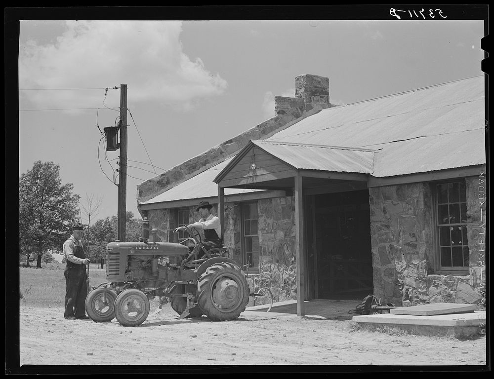Farmer bringing tractor for repairs at community service center. Faulkner County, Centerville, Arkansas (see general…