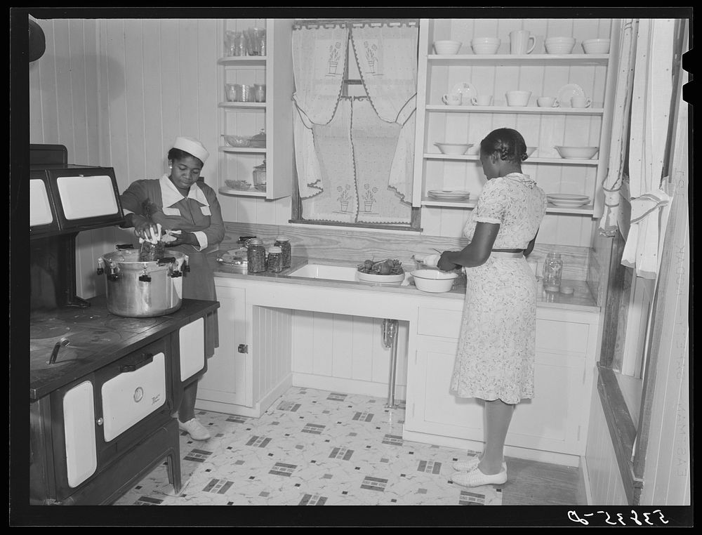 Violet Davenport and Almary Kelly canning squash during a canning demonstration give by home economist Rachel D. Moore at La…