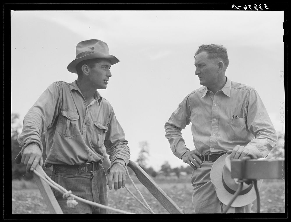 Parish FSA (Farm Security Administration) supervisor Willis R. Roberts talking and discussing farm problems with brother-in…