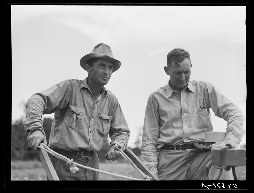 [Untitled photo, possibly related to: Parish FSA (Farm Security Administration) supervisor Willis R. Roberts talking and…
