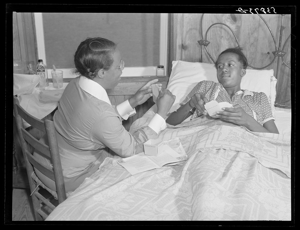 Nurse Marguerite White treating a patient. La Delta Project, Thomastown, Louisiana. Sourced from the Library of Congress.