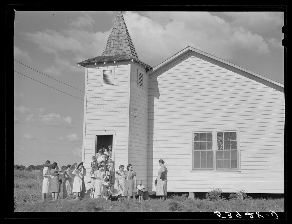 [Untitled photo, possibly related to: The women's club leaving the church and community building after a home management…