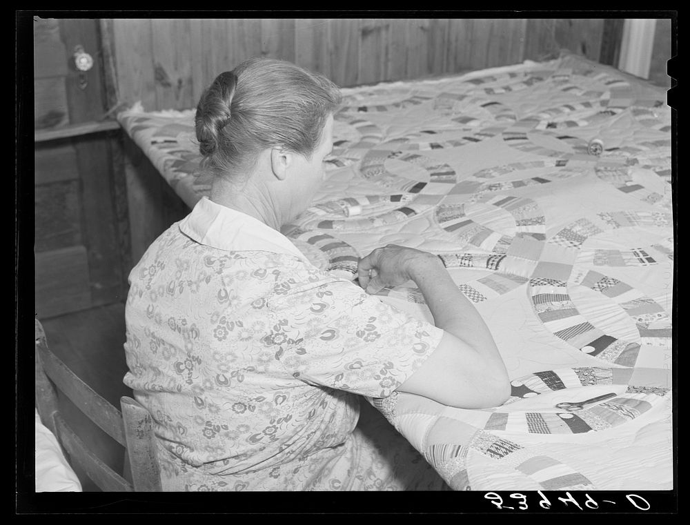 [Untitled photo, possibly related to: Mrs. Clarence N. Pace with her children and her mother-in-law quilting in their home.…