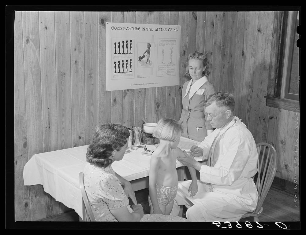 Mrs. M.E. Chappell with her daughter, Sybil Lee, being given typhoid anti-toxin by Dr. F.A. Williams, director of East…