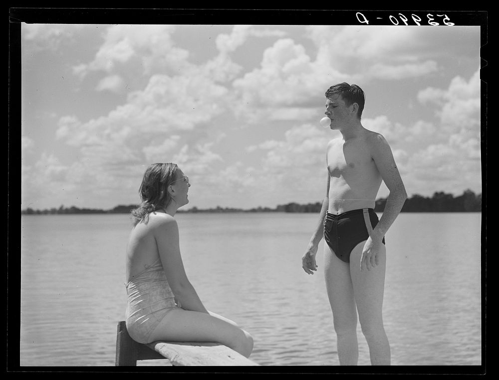 Blowing bubble gum is a Saturday afternoon and Sunday pastime while swimming in Lake Providence, Louisiana. Sourced from the…