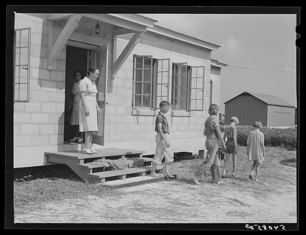 Children leaving health clinic after getting typhoid antitoxin shots at Osceola migratory labor camp. Belle Glade, Florida.…