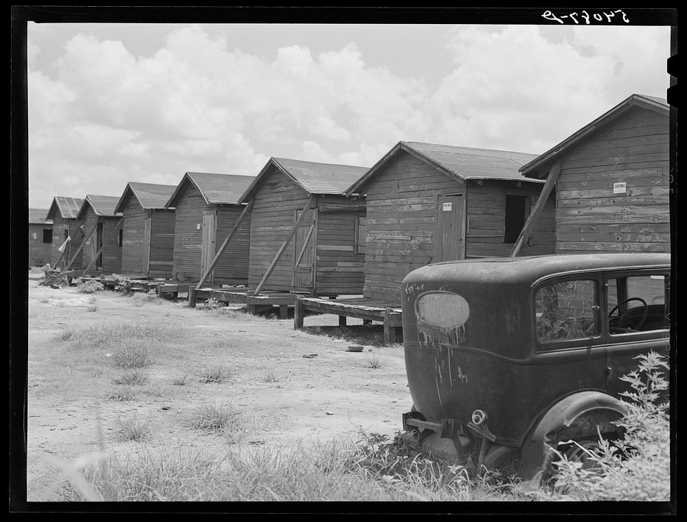 Shacks condemned by board of health, formerly lived in by migratory workers and pickers. Belle Glade, Florida. Sourced from…