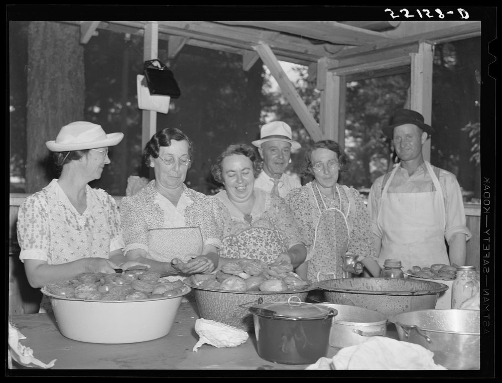 [Untitled photo, possibly related to: Parishioners peeling and slicing tomatoes for a benefit picnic supper on the grounds…