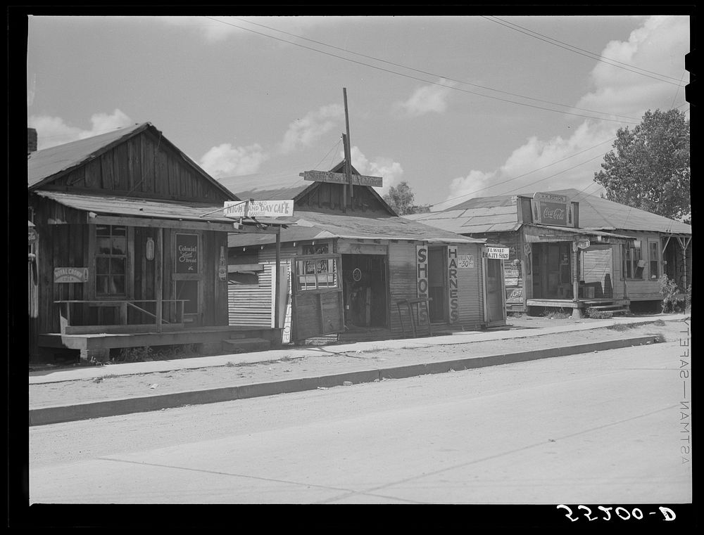 [Untitled photo, possibly related to: Shoe and harness repair and beauty shop in store. Shelby, Mississippi Delta…