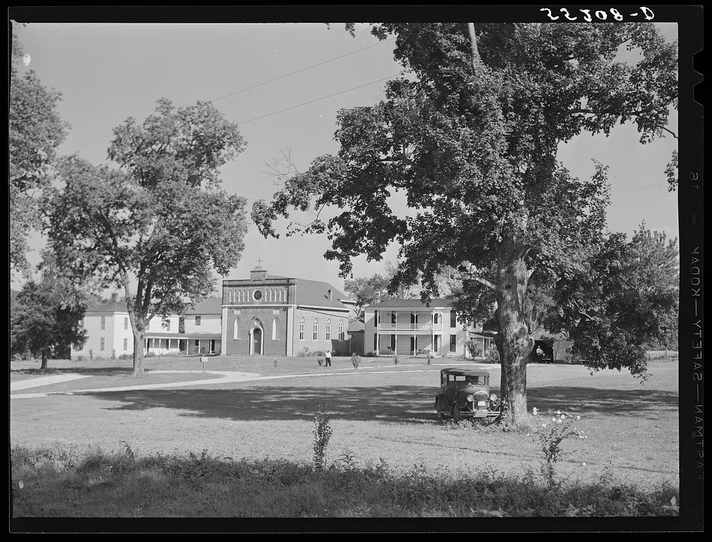 Church and rectory on the grounds of Saint Thomas' Church where a picnic is to be held. Near Bardstown, Kentucky. Sourced…
