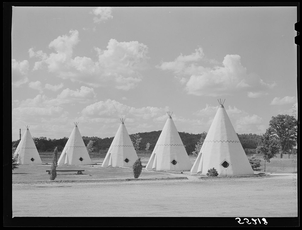 Cabins imitating the Indian teepee for tourists along highway south of Bardstown, Kentucky. Sourced from the Library of…
