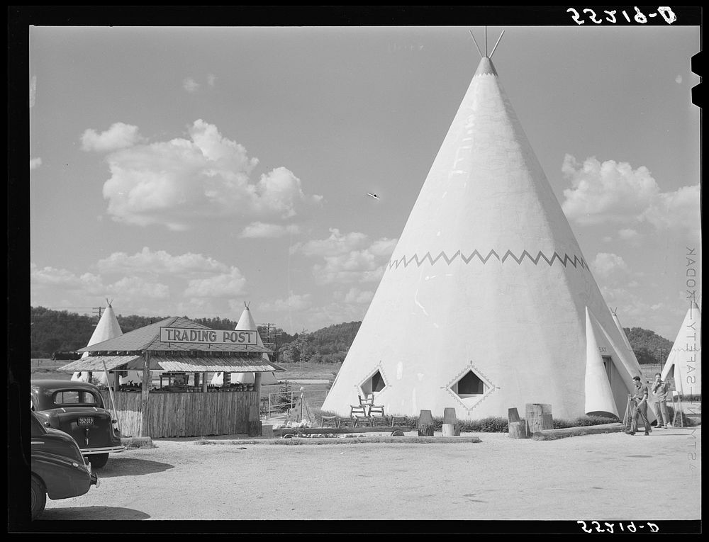 Cabins imitating the Indian teepee for tourists along highway south of Bardstown, Kentucky. Sourced from the Library of…
