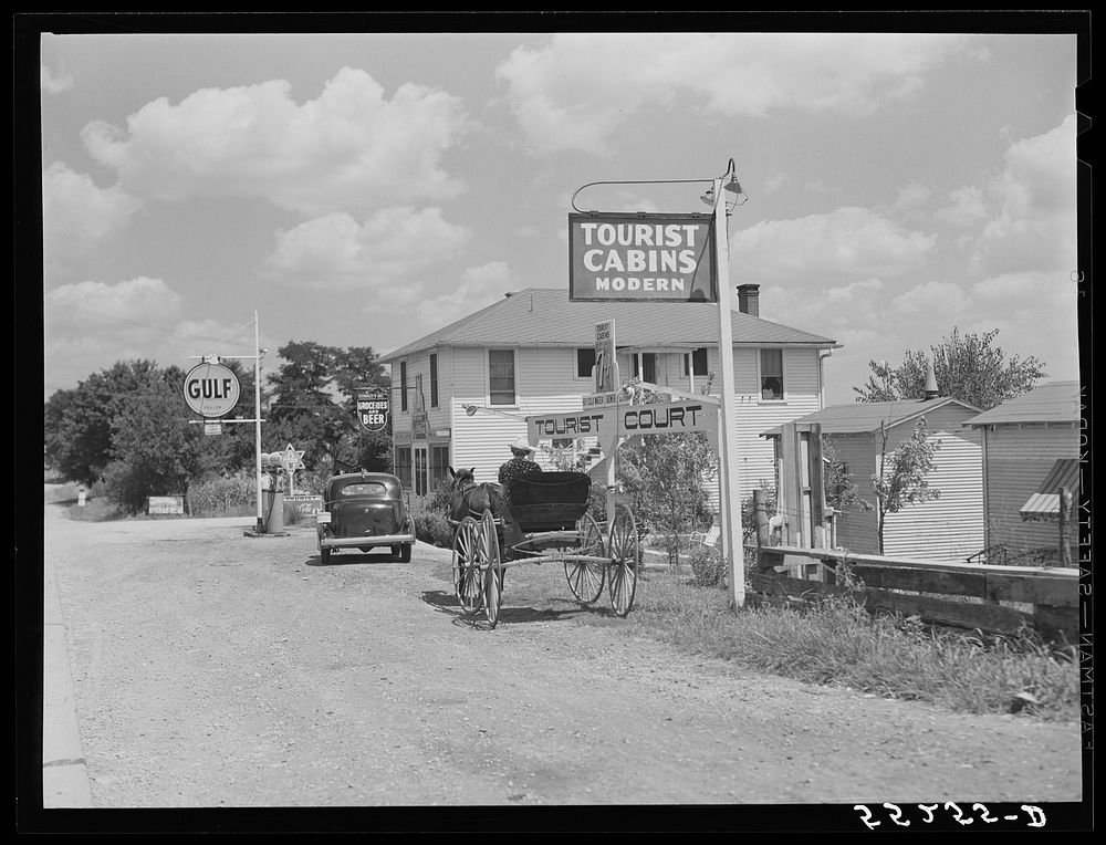 Grocery store, bar, gasoline station and tourist cabin along highway near Bardstown, Kentucky. Sourced from the Library of…
