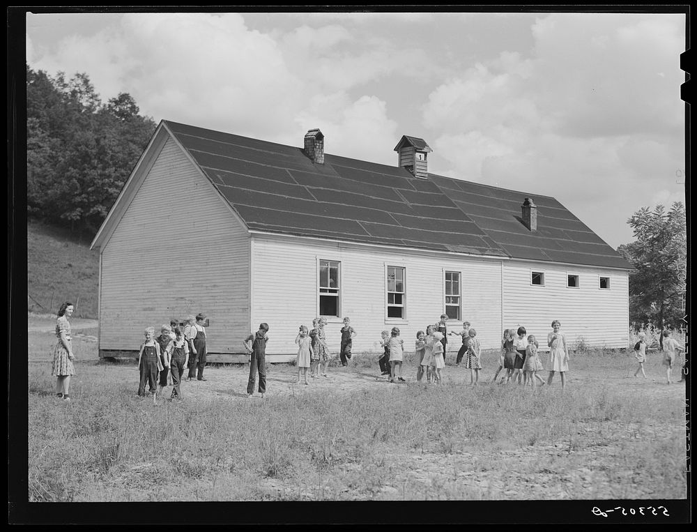 Two-room school house near Morehead, Kentucky. In these mountain areas the school term begins in June and goes through…