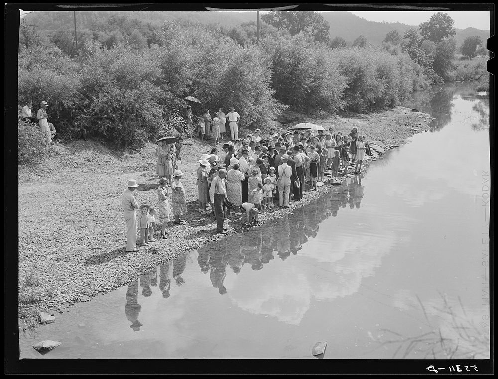Members of the Primitive Baptist Church in Morehead, Kentucky, attending a creek baptizing by submersion. Sourced from the…