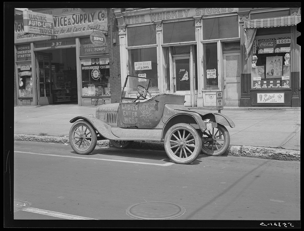 [Untitled photo, possibly related to: Car belonging to "Hep Cats" on main street in Louisville, Kentucky]. Sourced from the…