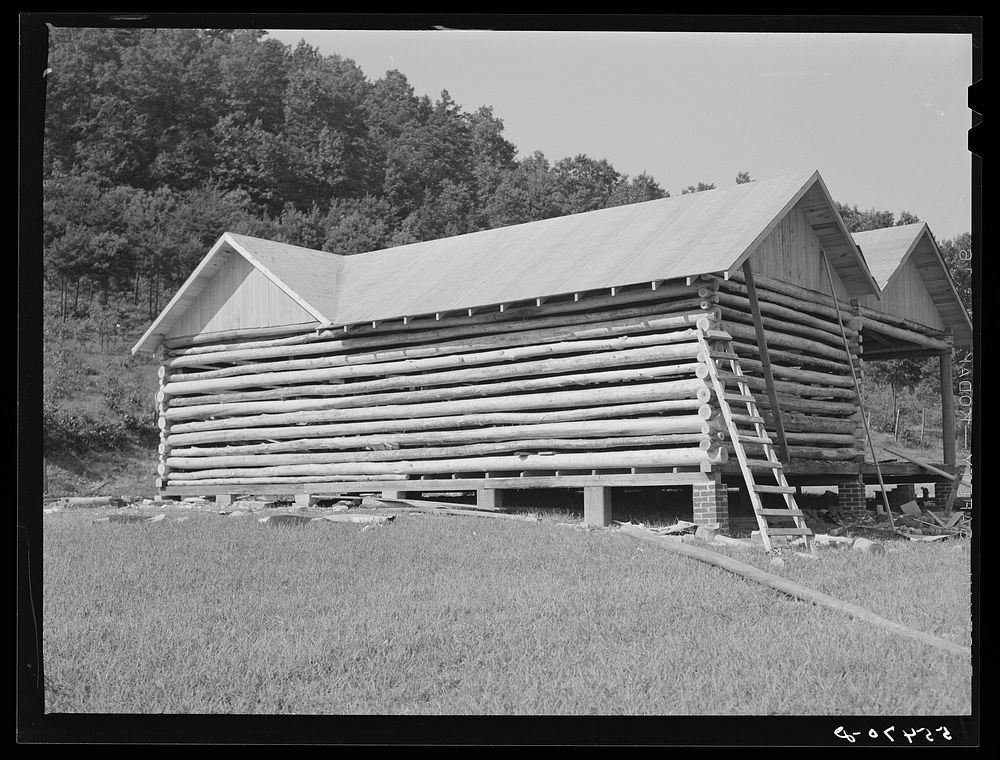 Modern log house under construction near Morehead, Kentucky. Sourced from the Library of Congress.