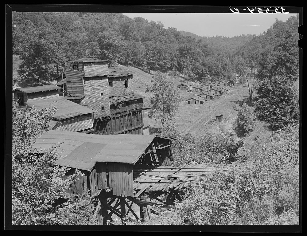 Abandoned tipple and coal miners' homes, some of whom still remain on relief, near Chavies, Perry County, Kentucky. Sourced…