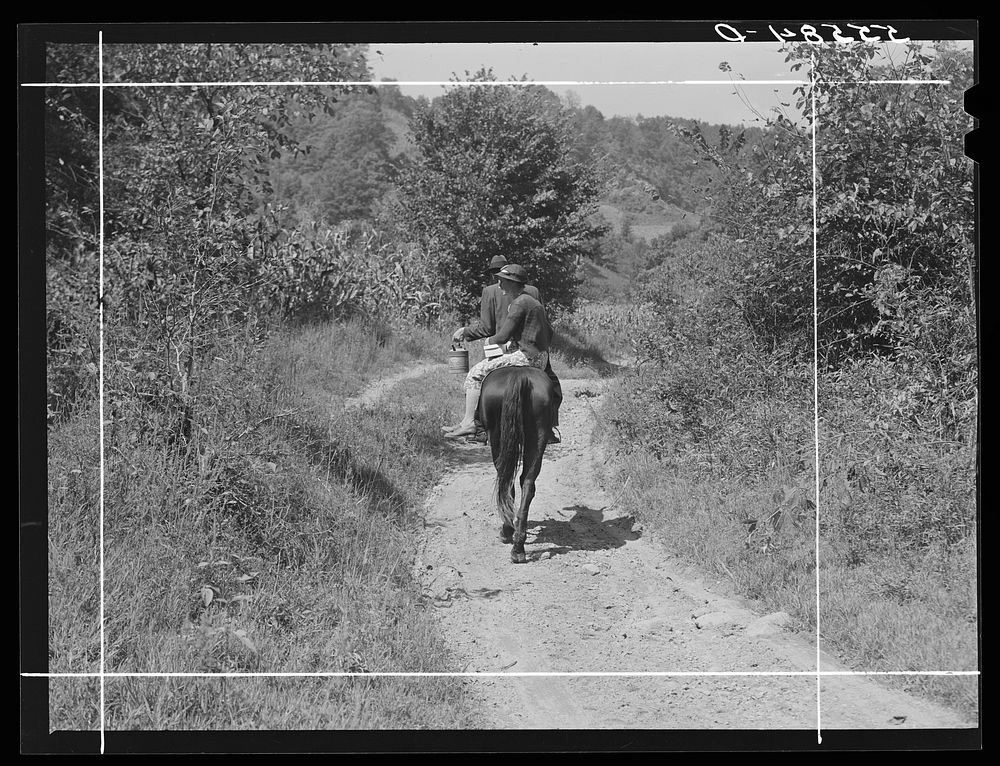 Mountaineer and wife riding home with groceries and supplies. Breathitt County, Kentucky. Sourced from the Library of…