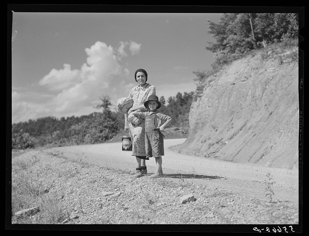 Mountain woman and child going home with groceries and supplies. Breathitt County, Kentucky. Sourced from the Library of…