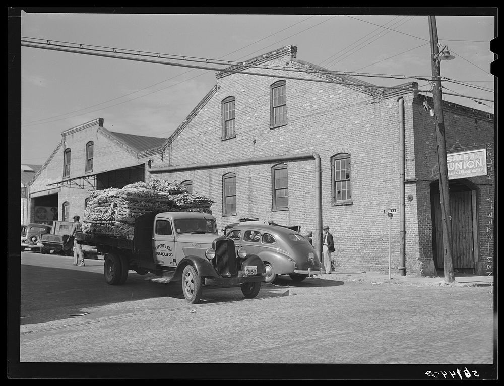 [Untitled photo, possibly related to: Transporting tobacco from warehouse after auction sale to the cigarette factories and…