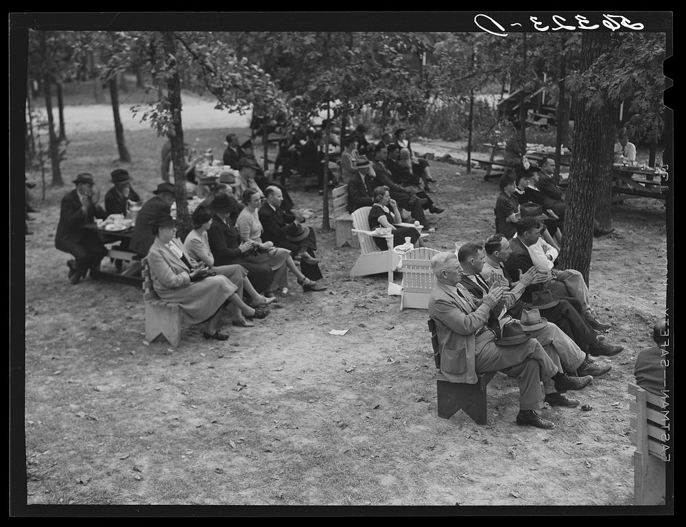 Citizens of Caswell County listening to speakers after a picnic and barbecue at the CCC (Civilian Conservation Corps) camp.…