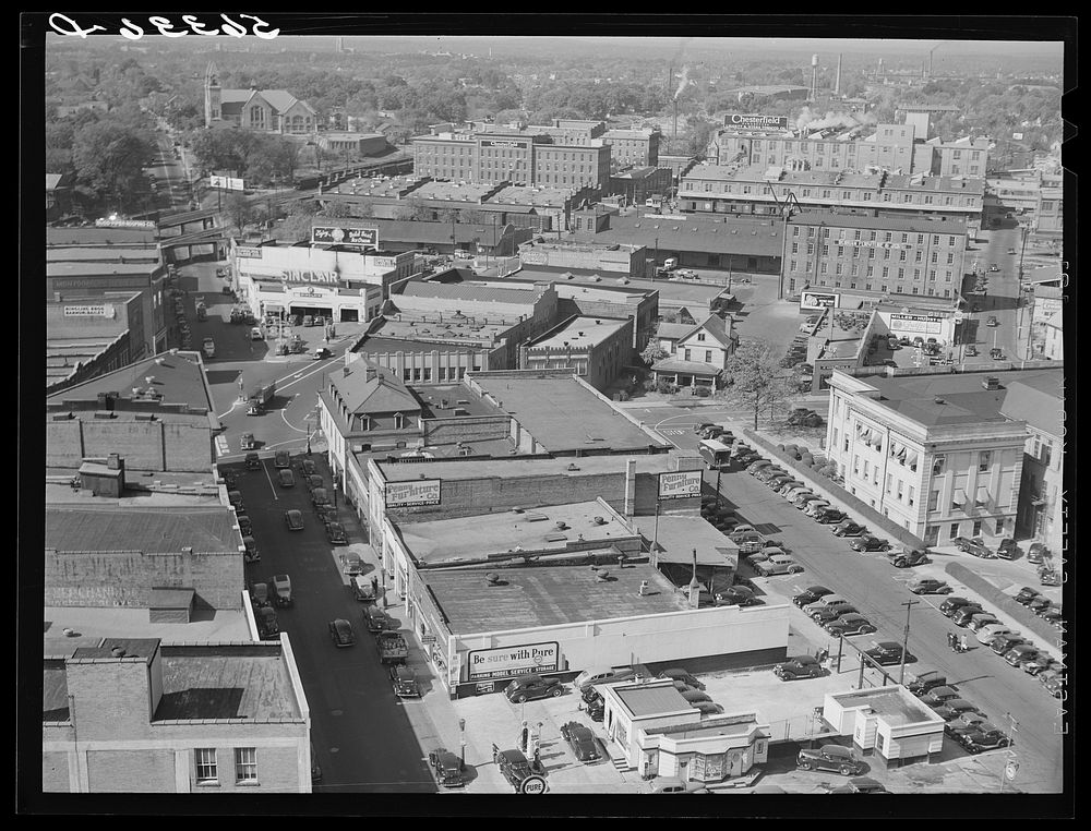 [Untitled photo, possibly related to: Five points, center of city, with Chesterfield cigarette factories in background.…