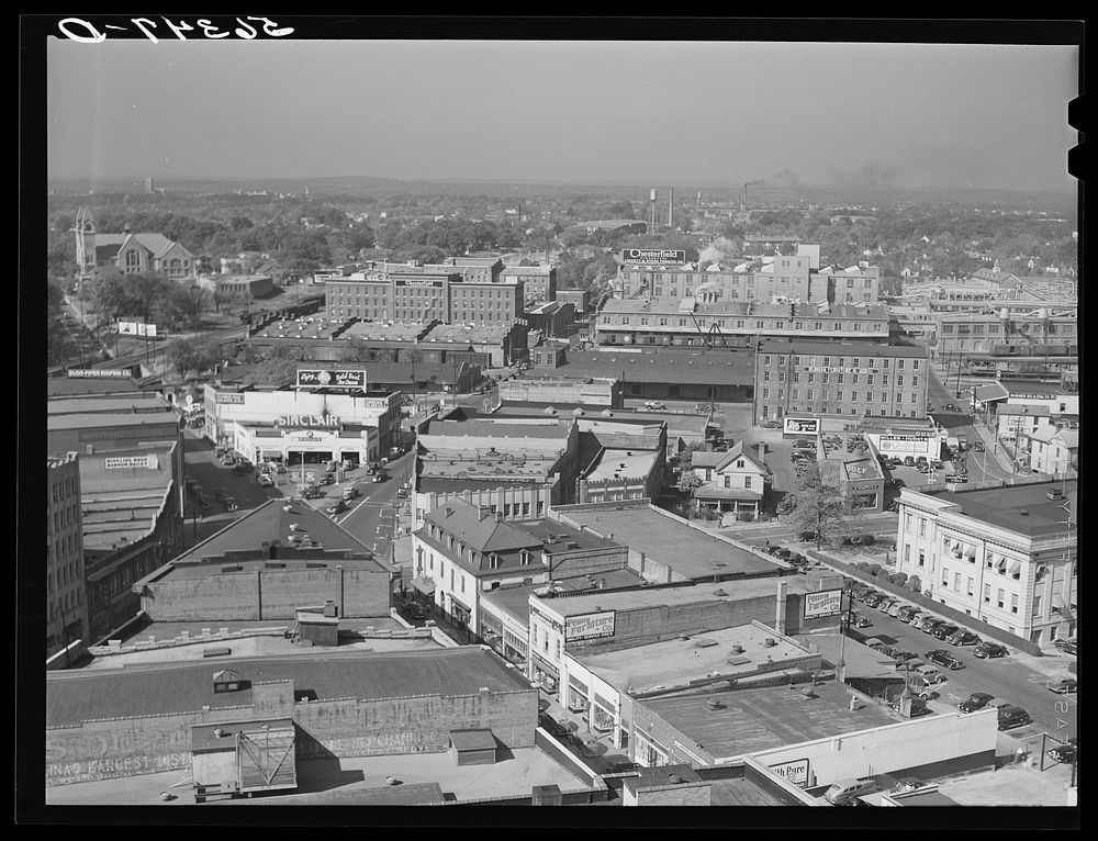 [Untitled photo, possibly related to: Five points, center of city, with Chesterfield cigarette factories in background.…