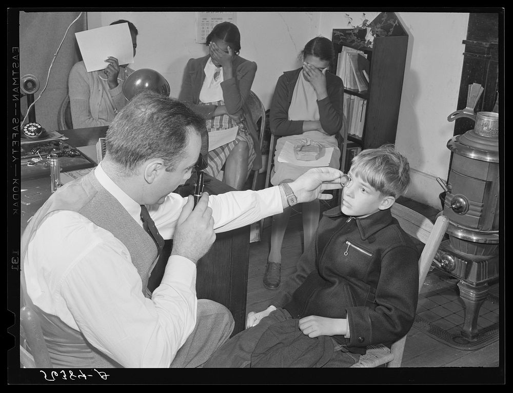 [Untitled photo, possibly related to: A FSA (Farm Security Administration) borrower's son being examined in the eye clinic…