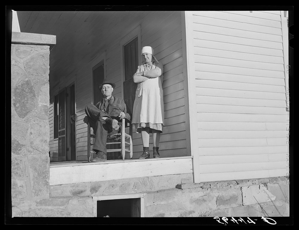 [Untitled photo, possibly related to: Josh Calahan and wife on the porch of their new home. Southern Appalachian Project…