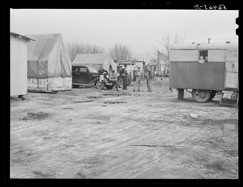 Metal shelters, tents, trailers of construction workers and Army families.  Metal shelters rent for ten dollars a month, and…