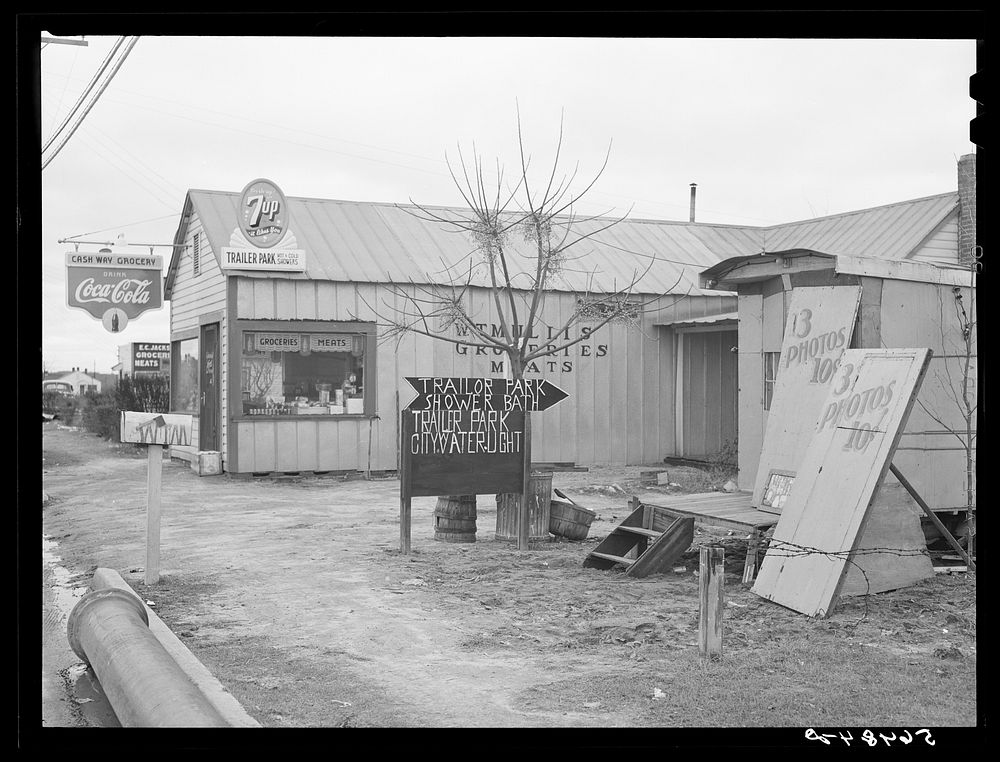 New sign in front of trailer park, and Itinerant photographer's trailer on highway near Fort Benning, Columbus, Georgia. Mr.…