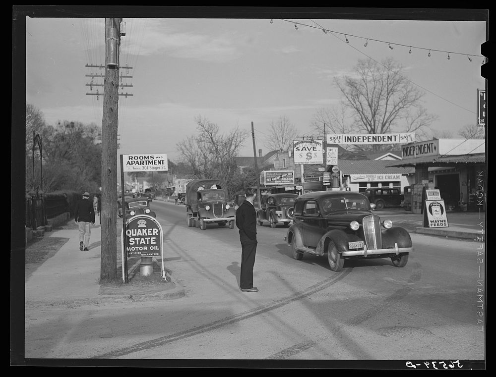 Pix from gas station, main street in Alexandria, shop signs, etc. Louisiana. Sourced from the Library of Congress.