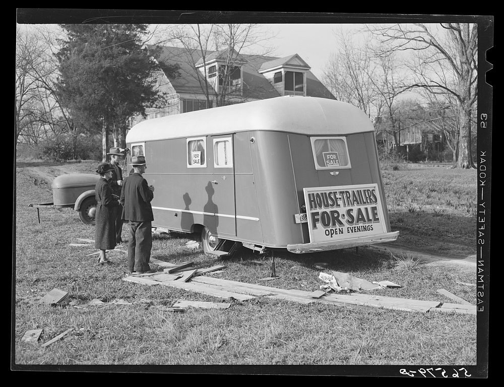 Trailers for sale with construction worker and his wife as possible prospective buyers, along main highway from Alexandria…