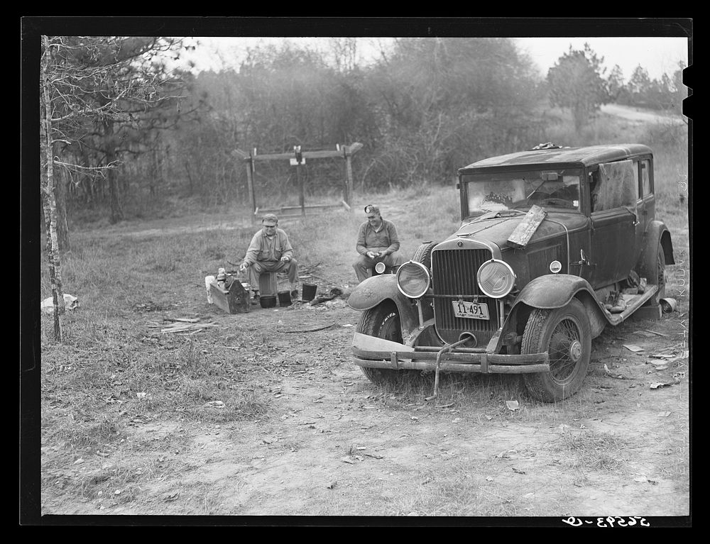 [Untitled photo, possibly related to: Close-up of car from Mississippi used for sleeping as well as shelter and traveling.…