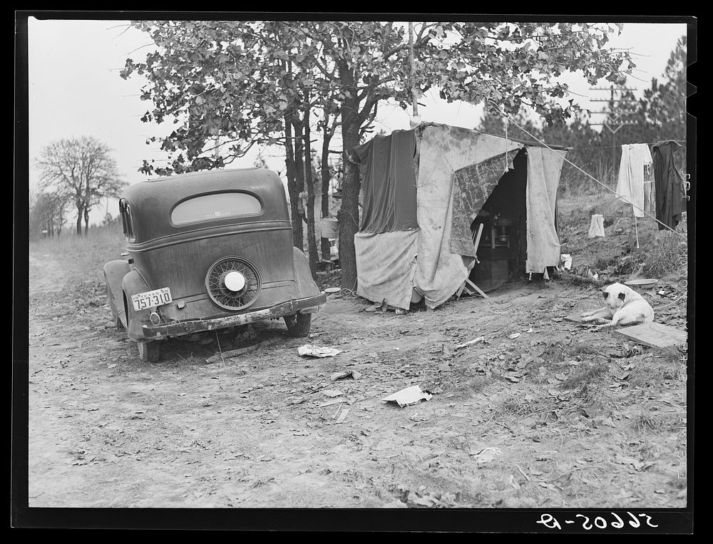 [Untitled photo, possibly related to: Construction worker's family Texas sleeping in car; cook and eat in lean-to. Near Camp…